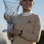 
              Lydia Ko of New Zealand smiles as she poses with the trophy after winning the Gainbridge LPGA golf tournament, Sunday, Jan. 30, 2022, in Boca Raton, Fla. (AP Photo/Rebecca Blackwell)
            