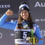 
              Italy's Elena Curtoni celebrates her first place on the podium of an alpine ski, women's World Cup super-G race in Cortina d'Ampezzo, Italy, Sunday, Jan. 23, 2022. (AP Photo/Alessandro Trovati)
            