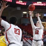 
              Texas Tech's Vivian Gray (12) shoots the ball during the first half of an NCAA college basketball game against Baylor, Wednesday, Jan. 26, 2022, in Lubbock, Texas. (AP Photo/Brad Tollefson)
            