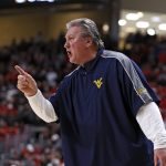 
              West Virginia coach Bob Huggins yells out to his players during the first half of an NCAA college basketball game against Texas Tech, Saturday, Jan. 22, 2022, in Lubbock, Texas. (AP Photo/Brad Tollefson)
            
