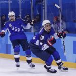 
              FILE - Jordan Greenway (18), of the United States, celebrates with teammate Bobby Sanguinetti (22) after scoring a goal during the second period of the preliminary round of the men's hockey game against Slovenia at the 2018 Winter Olympics in Gangneung, South Korea, Wednesday, Feb. 14, 2018. USA Hockey and Hockey Canada are eyeing several college players to play at the Olympics after the NHL decided not to participate in Beijing. Anaheim’s Troy Terry, Minnesota’s Jordan Greenway and Seattle’s Ryan Donato played for the U.S. in Pyeongchang. They are major proponents of college players taking the chance, even if it means missing part of the NCAA season. (AP Photo/Frank Franklin II, File)
            