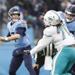 
              Tennessee Titans quarterback Ryan Tannehill (17) passes as he is pressured by Miami Dolphins defensive tackle Adam Butler (70) in the first half of an NFL football game Sunday, Jan. 2, 2022, in Nashville, Tenn. (AP Photo/Wade Payne)
            