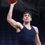 
              Xavier forward Zach Freemantle warms up for the team's NCAA college basketball game against Butler, Friday, Jan. 7, 2022, in Indianapolis. (AP Photo/Doug McSchooler)
            