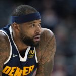 
              Denver Nuggets center DeMarcus Cousins takes the court for the first time as a member of the Nuggets in the first half of an NBA basketball game against the Detroit Pistons, Sunday, Jan. 23, 2022, in Denver. (AP Photo/David Zalubowski)
            