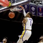 
              LSU guard Xavier Pinson (1) dunks against Kentucky in the second half of an NCAA college basketball game in Baton Rouge, La.., Tuesday, Jan. 4, 2022. (AP Photo/Derick Hingle)
            