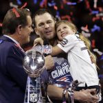 
              FILE - New England Patriots' Tom Brady holds his daughter, Vivian, after the NFL Super Bowl 53 football game against the Los Angeles Rams, Sunday, Feb. 3, 2019, in Atlanta. The Patriots won 13-3. Despite reports that he is retiring, Brady has told the Tampa Bay Buccaneers he hasn't made up his mind, two people familiar with the details told The Associated Press, Saturday, Jan. 29, 2022. (AP Photo/Mark Humphrey, File)
            