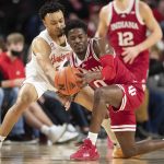 
              Nebraska's Trey McGowens, left, defends against Indiana's Xavier Johnson (0) during the first half of an NCAA college basketball game Monday, Jan. 17, 2022, in Lincoln, Neb. (AP Photo/Rebecca S. Gratz)
            