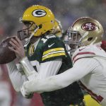 
              San Francisco 49ers' Arik Armstead sacks Green Bay Packers' Aaron Rodgers during the second half of an NFC divisional playoff NFL football game Saturday, Jan. 22, 2022, in Green Bay, Wis. (AP Photo/Aaron Gash)
            
