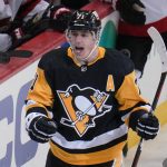 
              Pittsburgh Penguins' Evgeni Malkin celebrates as he returns to the bench after scoring during the first period of the team's NHL hockey game against the Ottawa Senators in Pittsburgh, Thursday, Jan. 20, 2022. (AP Photo/Gene J. Puskar)
            