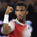 
              Felix Auger-Aliassime of Canada reacts after winning the second set against Daniil Medvedev of Russia during their quarterfinal match at the Australian Open tennis championships in Melbourne, Australia, Wednesday, Jan. 26, 2022. (AP Photo/Andy Brownbill)
            