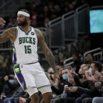
              Milwaukee Bucks' DeMarcus Cousins gestures after making a shot during the first half of the team's NBA basketball game against the Toronto Raptors on Wednesday, Jan. 5, 2022, in Milwaukee. (AP Photo/Aaron Gash)
            