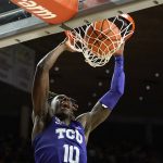 
              TCU guard Damion Baugh (10) dunks the ball during the second half of an NCAA college basketball game against Iowa State, Saturday, Jan. 22, 2022, in Ames, Iowa. (AP Photo/Charlie Neibergall)
            