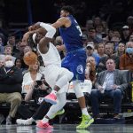 
              Oklahoma City Thunder forward Luguentz Dort, left, is fouled by Minnesota Timberwolves center Karl-Anthony Towns, right, in the first half of an NBA basketball game Friday, Jan. 7, 2022, in Oklahoma City. (AP Photo/Sue Ogrocki)
            