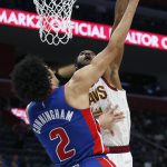 
              Detroit Pistons guard Cade Cunningham (2) has his shot blocked by Cleveland Cavaliers center Evan Mobley, right, during the first half of an NBA basketball game Sunday, Jan. 30, 2022, in Detroit. (AP Photo/Duane Burleson)
            