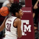 
              Texas A&M forward Javonte Brown (31) reacts after dunking the ball against Arkansas during the first half of an NCAA college basketball game Saturday, Jan. 8, 2022, in College Station, Texas. (AP Photo/Sam Craft)
            