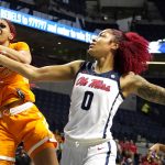 
              Tennessee center Tamari Key (20) pulls away a rebound while Mississippi forward Shakira Austin (0) attempts to steal the ball during the first half of an NCAA college basketball game in Oxford, Miss., Sunday, Jan. 9, 2022. (AP Photo/Rogelio V. Solis)
            