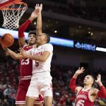 
              Nebraska's Bryce McGowens (5) shoots against Indiana's Trayce Jackson-Davis (23) and Parker Stewart (45) during the first half of an NCAA college basketball game Monday, Jan. 17, 2022, in Lincoln, Neb. (AP Photo/Rebecca S. Gratz)
            