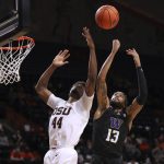 
              Oregon State's Ahmad Rand (44) and Washington's Langston Wilson (13) vie for possession of a rebound during the first half of an NCAA college basketball game Thursday, Jan. 20, 2022, in Corvallis, Ore. (AP Photo/Amanda Loman)
            