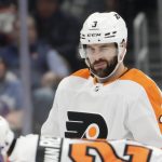 
              Philadelphia Flyers defenseman Keith Yandle (3) gestures before the first period of an NHL hockey game against the New York Islanders, Tuesday, Jan. 25, 2022, in Elmont, N.Y. Yandle broke an NHL record by playing in his 965th consecutive game on Tuesday. (AP Photo/Corey Sipkin)
            