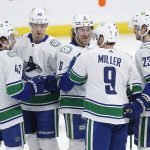 
              Vancouver Canucks' Quinn Hughes (43), Elias Pettersson (40), Brock Boeser (6), J.T. Miller (9) and Oliver Ekman-Larsson (23) celebrate Miller's goal against the Winnipeg Jets during the first period of an NHL hockey game, Thursday, Jan. 27, 2022 in Winnipeg, Manitoba. (John Woods/The Canadian Press via AP)
            