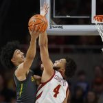 
              Baylor guard Kendall Brown (2) looks for a shot past Iowa State forward George Conditt (4) during the first half of an NCAA college basketball game, Saturday, Jan. 1, 2022, in Ames. (AP Photo/Matthew Putney)
            