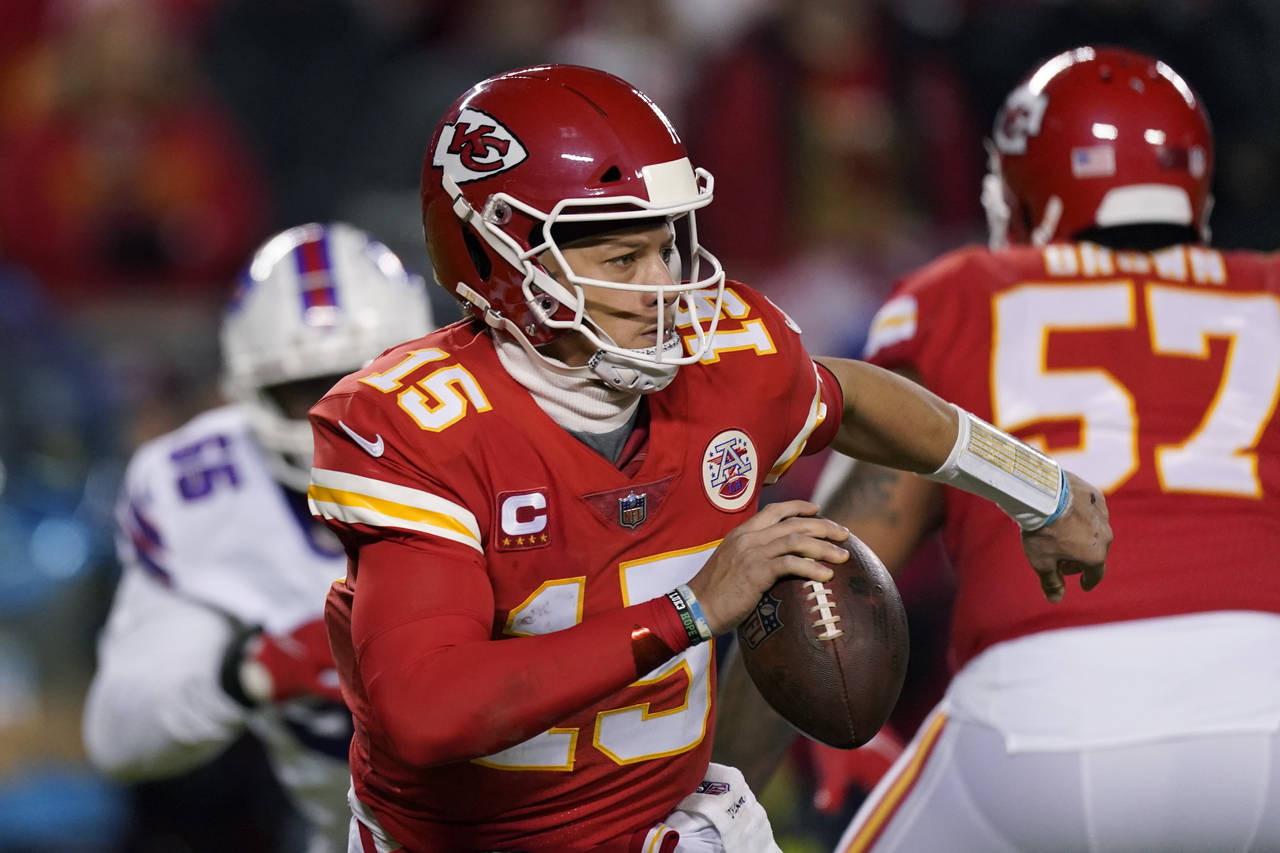 Kansas City Chiefs quarterback Patrick Mahomes (15) looks to pass during the first half of an NFL d...