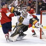 
              Florida Panthers center Sam Bennett (9) runs into Vegas Golden Knights goaltender Robin Lehner (90) during the second period of an NHL hockey game, Thursday, Jan. 27, 2022, in Sunrise, Fla. Bennett was penalized for goalie interference on the play. (AP Photo/Lynne Sladky)
            