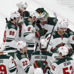 
              The Minnesota Wild celebrate after defeating the Boston Bruins in an NHL hockey game Thursday, Jan. 6, 2022, in Boston. (AP Photo/Michael Dwyer)
            