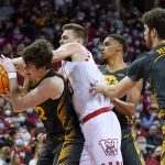 
              Iowa's Patrick McCaffery, left, and Wisconsin's Chris Vogt compete for the ball during the second half of an NCAA college basketball game Thursday, Jan. 6, 2022, in Madison, Wis. Wisconsin won 87-78. (AP Photo/Andy Manis)
            