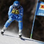 
              Italy's Elena Curtoni speeds down the course of an alpine ski, women's World Cup super-G race in Cortina d'Ampezzo, Italy, Sunday, Jan. 23, 2022. (AP Photo/Gabriele Facciotti)
            
