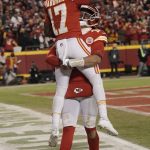 
              Kansas City Chiefs wide receiver Mecole Hardman (17) celebrates with teammate Patrick Mahomes after scoring on a 25-yard touchdown run during the second half of an NFL divisional round playoff football game against the Buffalo Bills, Sunday, Jan. 23, 2022, in Kansas City, Mo. (AP Photo/Charlie Riedel)
            