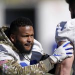 
              Los Angeles Rams defensive end Aaron Donald, left, works out with nose tackle Greg Gaines during an NFL football practice Friday, Jan. 28, 2022, in Thousand Oaks, Calif., ahead of their NFC championship game against the San Francisco 49ers on Sunday. (AP Photo/Mark J. Terrill)
            