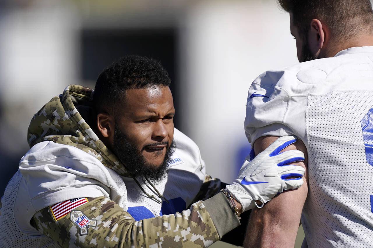 Los Angeles Rams defensive end Aaron Donald, left, works out with nose tackle Greg Gaines during an...