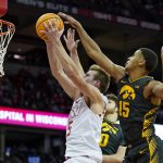 
              Wisconsin's Tyler Wahl (5) shoots against Iowa's Keegan Murray (15) during the second half of an NCAA college basketball game Thursday, Jan. 6, 2022, in Madison, Wis. (AP Photo/Andy Manis)
            