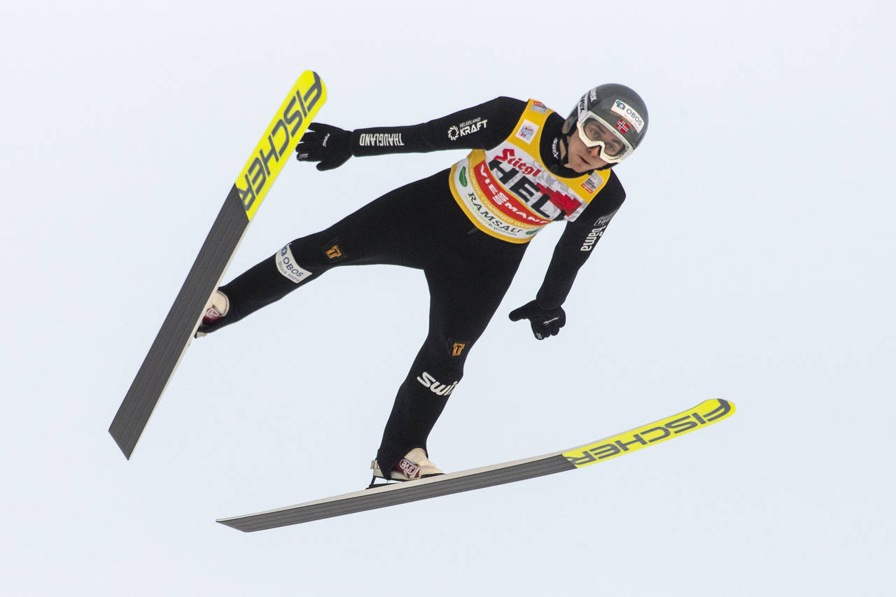 FILE - Jarl Magnus Riiber of Norway soars through the air during the men's ski jumping competition ...