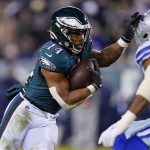 
              Philadelphia Eagles running back Kenneth Gainwell runs with the ball during the first half of an NFL football game against the Dallas Cowboys, Saturday, Jan. 8, 2022, in Philadelphia. (AP Photo/Julio Cortez)
            