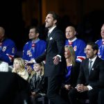 
              Former New York Rangers goaltender Henrik Lundqvist, center, watches as his number is retired before an NHL hockey game between the Rangers and the Minnesota Wild  Friday, Jan. 28, 2022 in New York. . He was joined by four former Rangers who have also had their number retired, left to right, Mark Messier, Mike Richter, Adam Graves and Brian Leetch. (AP Photo/John Munson)
            