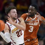 
              Iowa State guard Gabe Kalscheur (22) passes ahead of Texas guard Courtney Ramey (3) during the second half of an NCAA college basketball game, Saturday, Jan. 15, 2022, in Ames, Iowa. Iowa State won 79-70. (AP Photo/Charlie Neibergall)
            
