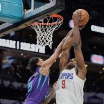
              Los Angeles Clippers center Serge Ibaka (9) drives towards the basket as Charlotte Hornets guard James Bouknight, left, defends during the first half of an NBA basketball game Sunday, Jan. 30, 2022, in Charlotte, N.C. (AP Photo/Rusty Jones)
            