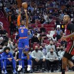 
              New York Knicks guard RJ Barrett (9) shoots a three-point basket over Miami Heat forward P.J. Tucker during the first half of an NBA basketball game, Wednesday, Jan. 26, 2022, in Miami. (AP Photo/Lynne Sladky)
            