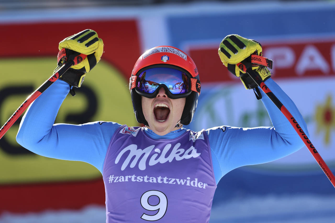 Italy's Federica Brignone celebrates at finish area after completing an alpine ski, women's World C...