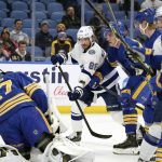 
              Tampa Bay Lightning right wing Nikita Kucherov (86) shoots during the second period of an NHL hockey game against the Buffalo Sabres on Tuesday, Jan. 11, 2022, in Buffalo, N.Y. (AP Photo/Joshua Bessex)
            