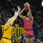 
              Arizona guard Dalen Terry (4) shoots a 3-pointer over California forward Grant Anticevich (15) during the first half of an NCAA college basketball game in Berkeley, Calif., Sunday, Jan. 23, 2022. (AP Photo/Tony Avelar)
            
