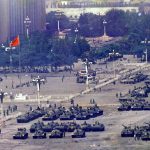 
              FILE - Chinese troops and tanks gather in Beijing, one day after the military crackdown that ended a seven week pro-democracy demonstration on Tiananmen Square in Beijing on June 5, 1989. From the military suppression of Beijing’s 1989 pro-democracy protests to the less deadly crushing of Hong Kong’s opposition four decades later, China’s long-ruling Communist Party has demonstrated a determination and ability to stay in power that is seemingly impervious to Western criticism and sanctions. (AP Photo/Jeff Widener, File)
            