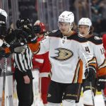 
              Anaheim Ducks forward Trevor Zegras (46) is congratulated for his goal against the Detroit Red Wings during the first period of an NHL hockey game Sunday, Jan. 9, 2022, in Anaheim, Calif. (AP Photo/Ringo H.W. Chiu)
            