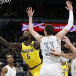 
              Indiana Pacers guard Lance Stephenson (6) tries to score past Oklahoma City Thunder center Mike Muscala (33) as Pacers center Domantas Sabonis, right, looks on in the first half of an NBA basketball game Friday, Jan. 28, 2022, in Oklahoma City. (AP Photo/Nate Billings)
            