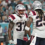 
              New England Patriots running back Damien Harris (37) celebrates with New England Patriots running back Brandon Bolden (25) after scoring a touchdown during the second half of an NFL football game, Sunday, Jan. 9, 2022, in Miami Gardens, Fla. (AP Photo/Lynne Sladky)
            