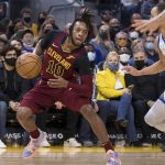 
              Cleveland Cavaliers guard Darius Garland (10) dribbles against the Golden State Warriors during the first half of an NBA basketball game in San Francisco, Sunday, Jan. 9, 2022. (AP Photo/John Hefti)
            