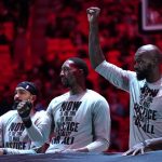 
              Miami Heat guard Gabe Vincent, left, center Bam Adebayo, center, and center Dewayne Dedmon, right, stand during a ceremony honoring Martin Luther King Jr. before an NBA basketball game against the Toronto Raptors, Monday, Jan. 17, 2022, in Miami. (AP Photo/Lynne Sladky)
            