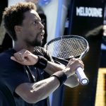 
              Gael Monfils of France reacts after defeating Cristian Garin of Chile in their third round match at the Australian Open tennis championships in Melbourne, Australia, Friday, Jan. 21, 2022. (AP Photo/Hamish Blair)
            